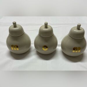 Elegant Beige Ceramic Jars with Gold Accents